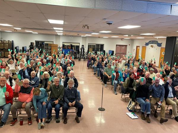 A large group of people sitting. 